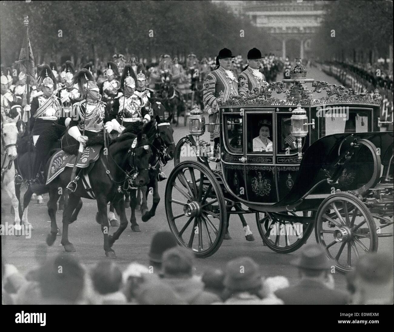 Oct. 10, 1962 - Parliament State Opening: The Queen Returns To Palace: The Queen drove in state to open parliament yesterday. Afterwards she returned to Buckingham Palace in the Irish State Coach. Photo shows: The Queen is driven past the Victoria memorial at the gates of the palace. Stock Photo