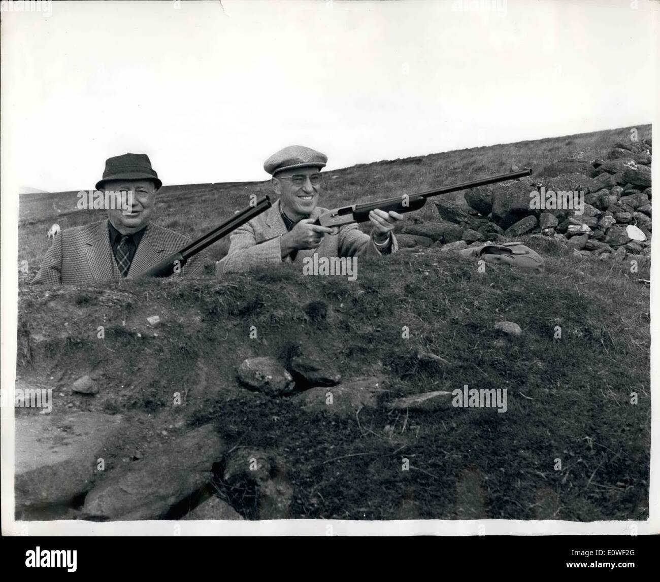 Aug. 08, 1962 - Americans go a-grousing: Yesterday was the start of the Grouse Shooting season. On the Perthshire moors, the National Cash Register Company of America held their shoot. Nine were guests of President, Mr.S.C.Allyen. Photo shows the butts:Mr. Allyen (left) and Mr.T.E.Sunderland of the United Fruit Company of America. Stock Photo