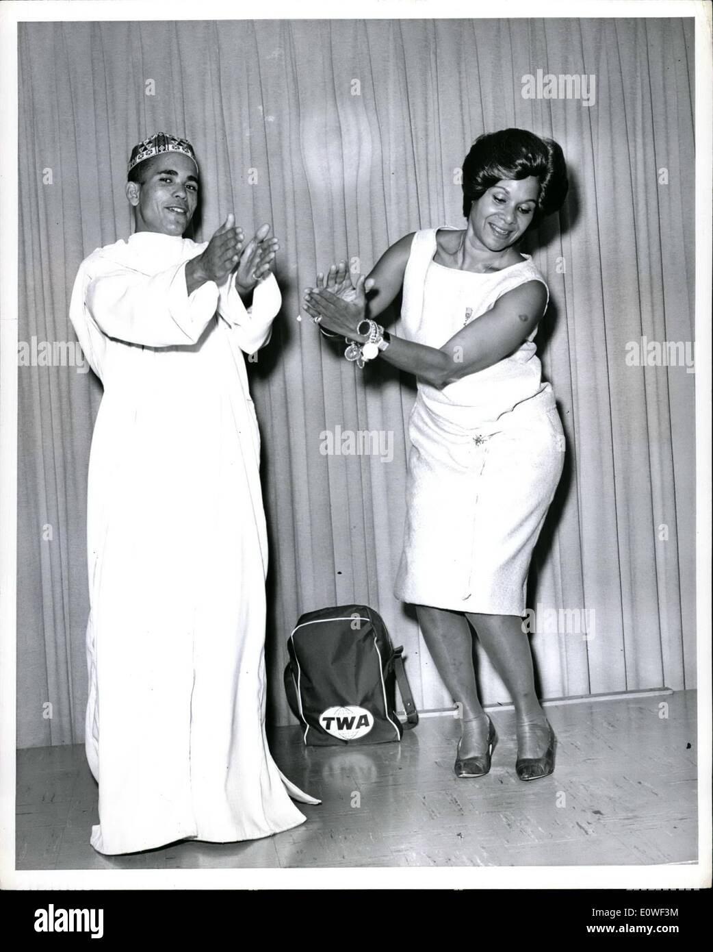 Aug. 08, 1962 - Moroccan Roll: New York International Airport, World famous dancer Katherine Dunbam is shown dancing with 18-year-old Ali Abderrahman, one of the fourteen Royal Dancers from the Court of Morocco who arrived by TWA Super Jet from Paris. The troupe came to the U.S. after ten years of negotiations by Miss Dunham with King Hassan II of Morocco, and will tour the U.S. in a new show with her for thirty-eight weeks. Stock Photo