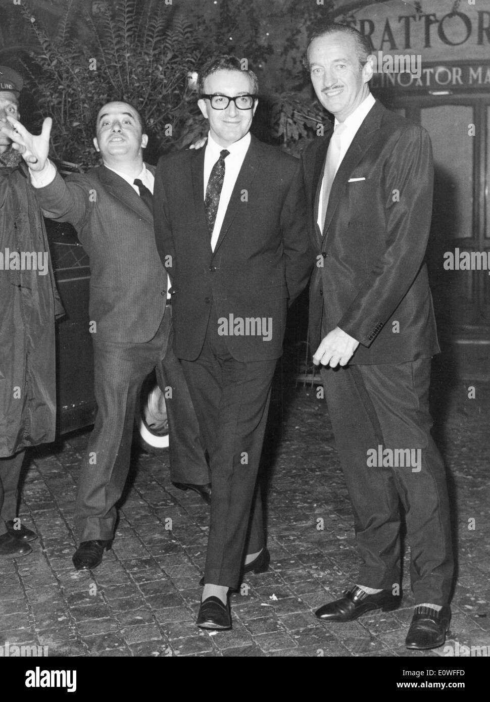 Actors David Niven and Peter Sellers leave Trattoria Stock Photo