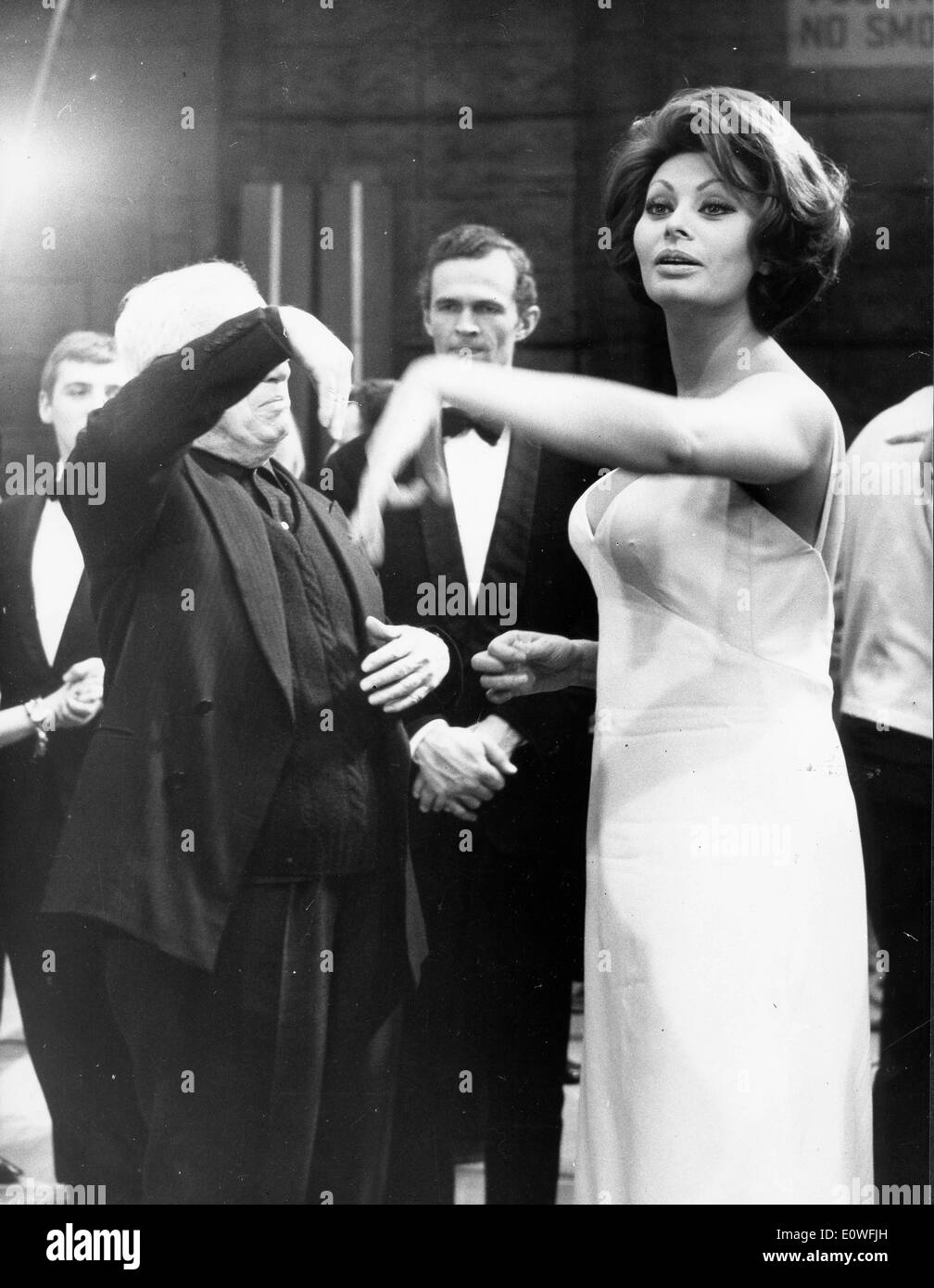 Actress Sophia Loren dances with a blindfolded Charlie Chaplin Stock Photo