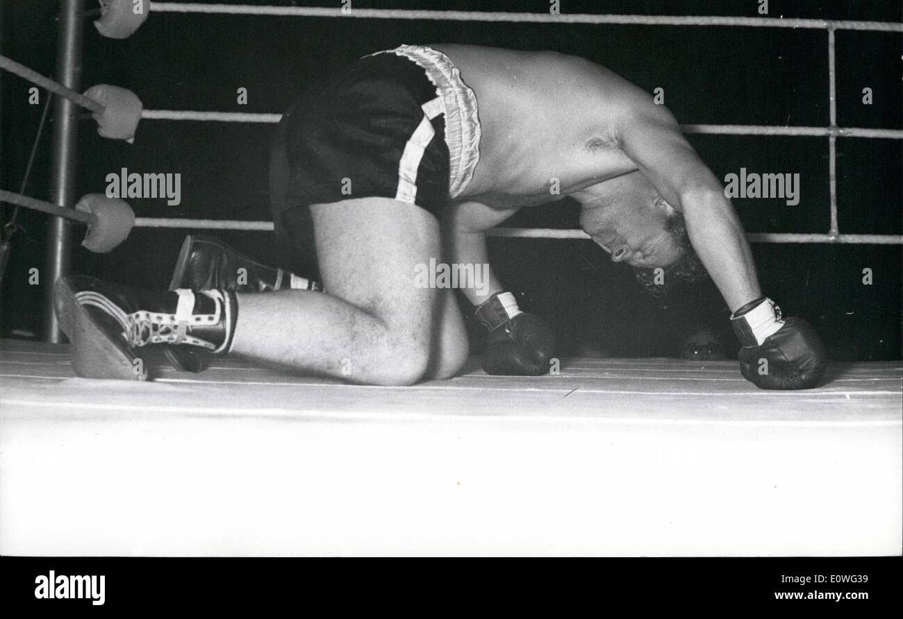 Nov. 11, 1962 - WALKER K.O.'S LaSAGA AT WEVRLEY Brit in 's WALKER knocked out Canadian lumber- jack PHONULaSAG, n minute, 57 seconds of the first round in theirfight at Wembley last night. As angry fans shouted their disapproval of the disappointing fight, the Boxing Board announced that LaSAGA's purse money was being withheld pending son inquiry at the Board s offices today. PICTURE SHOW LeSAGA down on all fours after the rom WALKER which floored him. Stock Photo