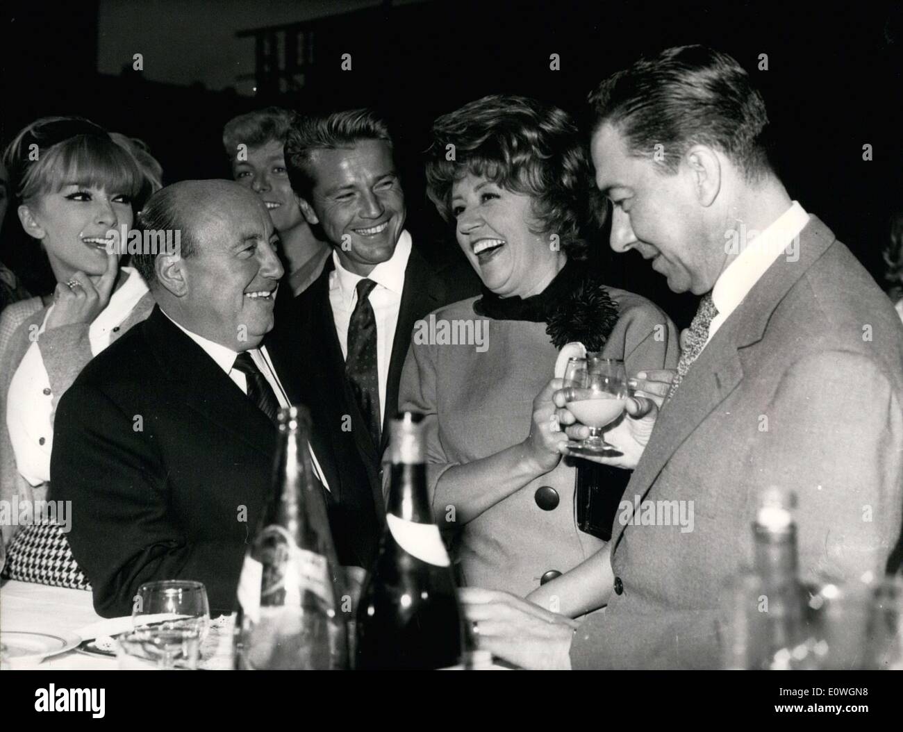 Sep. 14, 1962 - Director Marcel Carne just started filming his new movie ''Chicken Feed for Little Birds''. He is returning to comical movies for the first time in 25 years. Carne is pictured here with some of his principal actors at a reception given at Epinay Studio to celebrate his starting filming. Stock Photo
