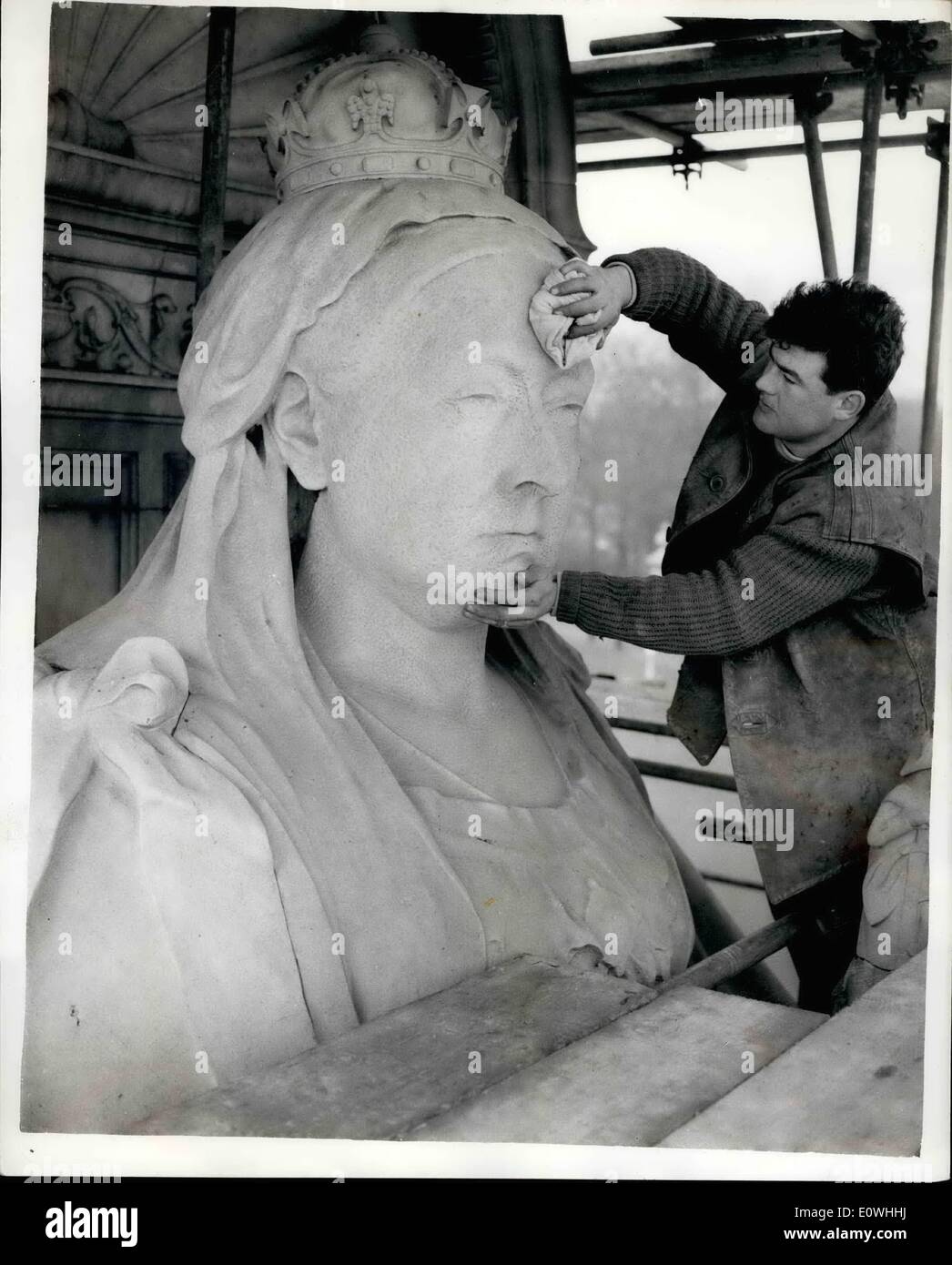 Feb. 02, 1963 - Inspection and Cleaning of the Victoria Memorial: Men were busily at work this morning erecting scaffolding around the Queen Victoria Memorial - outside Bukinghan Palace. The Statue in due for a cleaning - and renovation. Photo shows Mr. Brian Williams from Wellington, Surrey - cleaning the brow - of the statue - this morning. Stock Photo