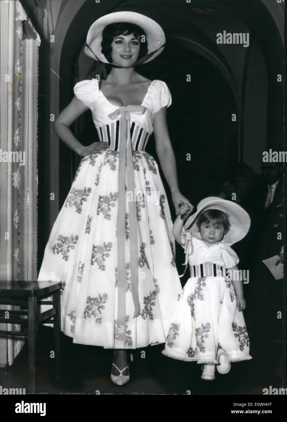 Feb. 02, 1963 - His homely love for costumes of the young fashion creator Werner Wunderlich (Munich) could be seen also during his spring and summer dress parade some days ago. A lot of approval was spent, when Pat and little Alexandra (mother and daughter) came with the same beautiful cambric evening dress. Everybody knew, that the model for this dress could only have been Bavarian costume. Stock Photo
