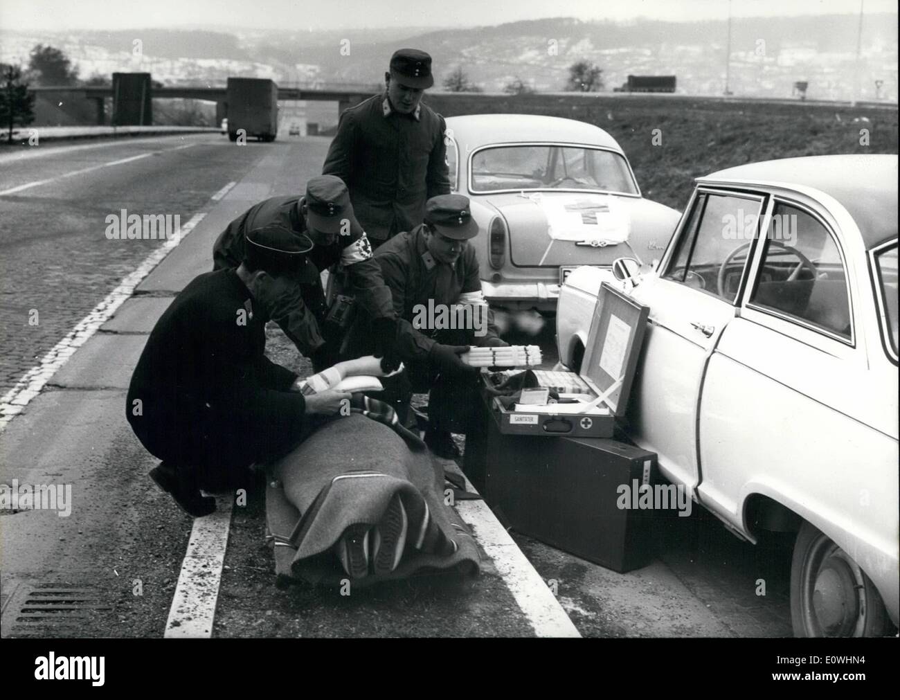 Jan. 01, 1963 - Spontaneous and gratis; the Red Cross helpers of the Pforzheim DRK (=German Red Cross) in future will make a Sunday service on the express motor road. By their private cars, which are signed by a red cross on the bonnst and also on the after deck, they are waiting in a petrol station on the express motor road at the risky steep part of the road in Pforzheim, to can help immediately when it is necessary. On the last weekend the first initiative took place. The private cars are equipped by the modernst medical remedies Stock Photo