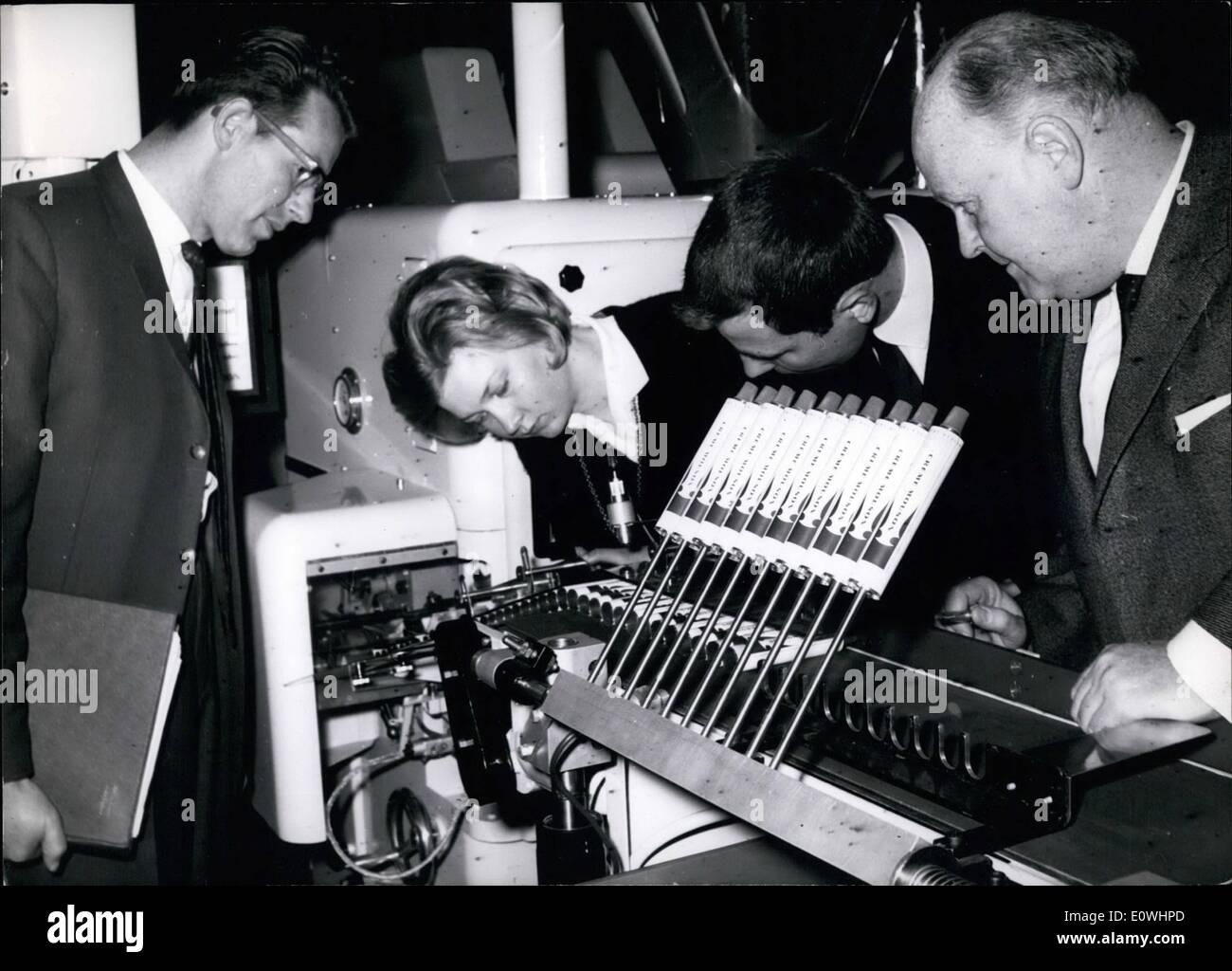 May 05, 1963 - Beauty from the Tube: This Sunday 12.5.1963 opens a new great industry-exhibition for packing - machine in Dusseldorf in Germany. On this exhibition named ''Interpack'' show 548 firms from the Inland and the foreign countries new packing - machines. picture Shows: Such a packing machine by filling little tubes with Cosmetic- Ointment. Stock Photo