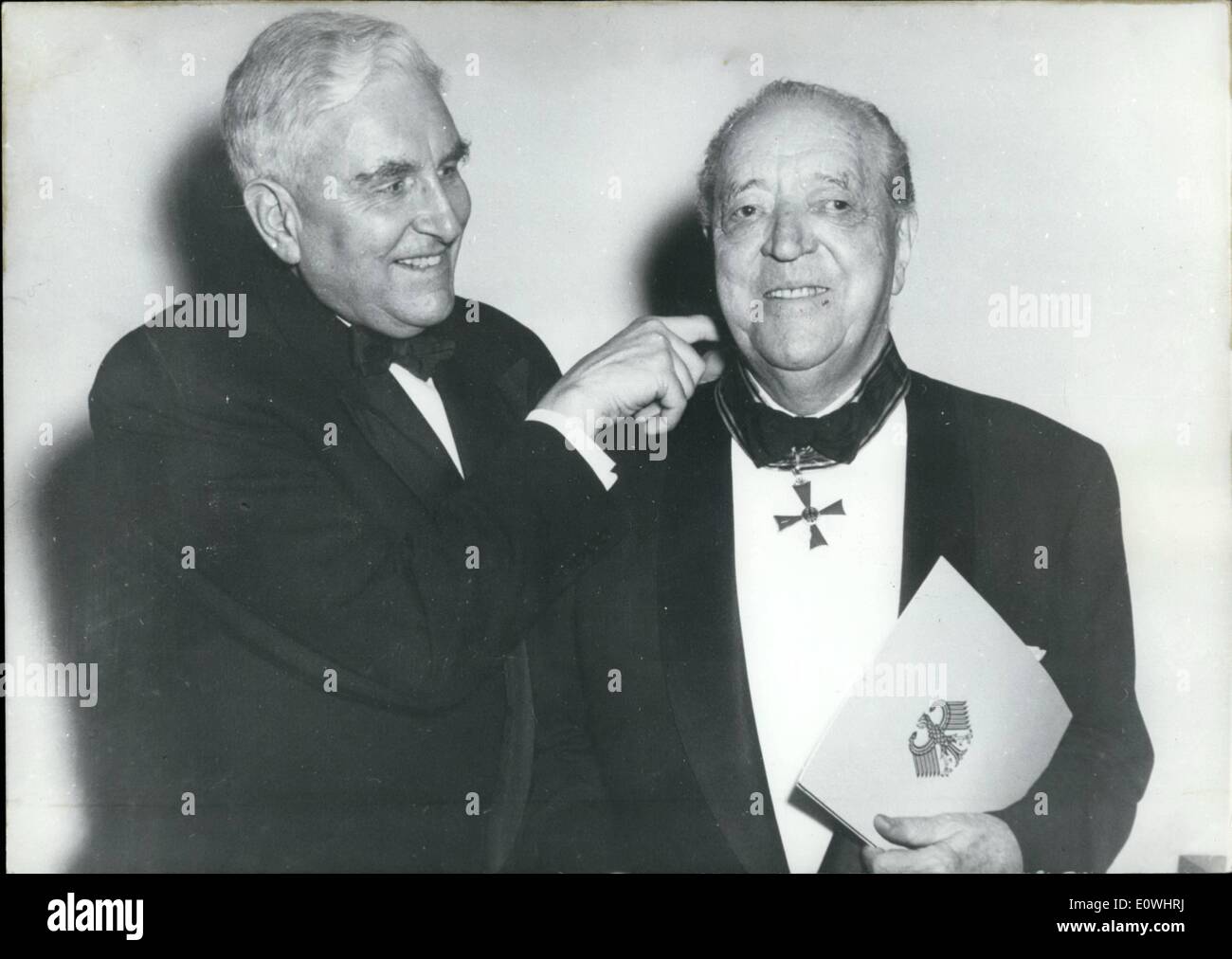 May 05, 1963 - Pictured: The German General Consul in Chicago, Dr. Friedrich Freiherr von Lupin left hands over the Grand Cross Stock Photo