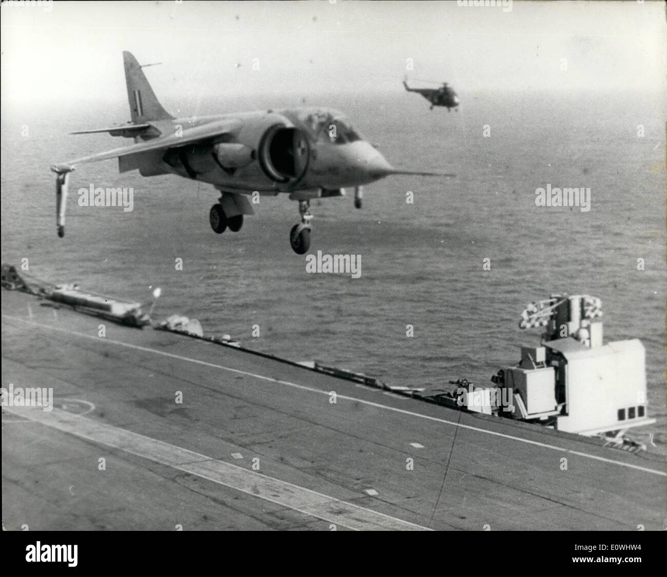 Feb. 02, 1963 - The Hawker P.1127 Makes First Vertical Landing On Aircraft Carrier.. Intensive flight trials were carried out during the week-end aboard the aircraft carrier H.M.S. Ark Royal in the Channel - during which the Hawker P.1127 subsonic strike fighter made the first ever vertical landing by a jet aircraft on a carrier - at sea.. Keystone Press Shows:- The Hawker P.1127 during her landing trials aboard the H.M.S. Ark Royal. Stock Photo