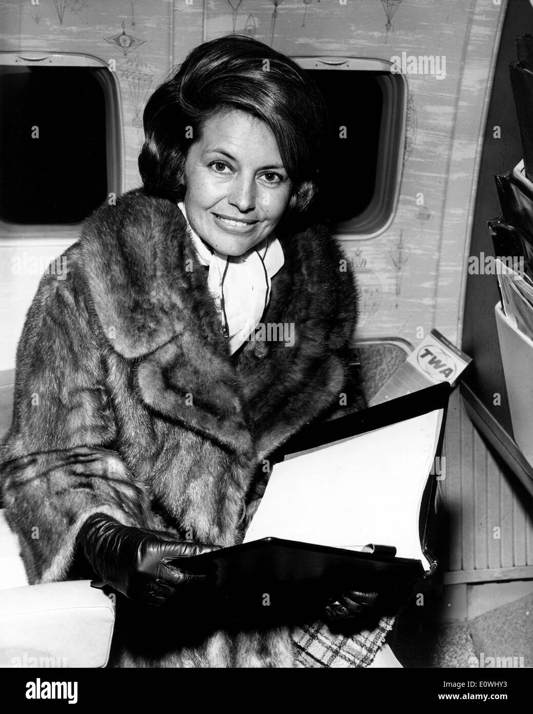 Actress Cyd Charisse reading a script on a flight Stock Photo