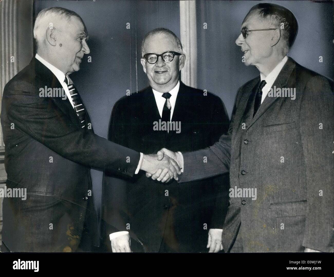 Mar. 03, 1963 - US and URSS scientists are meeting in Rome to discuss a cooperative program of joint studies of cuter space. The opening occasion of the meeting was held in the US Embassy. Photo Shows the leaders of the Soviet and the American delegations Anatoli Blagonravov and Hugh Dryden shake hands Minister Francis Willtaneon deputy chief of the Mission, looks on. Stock Photo