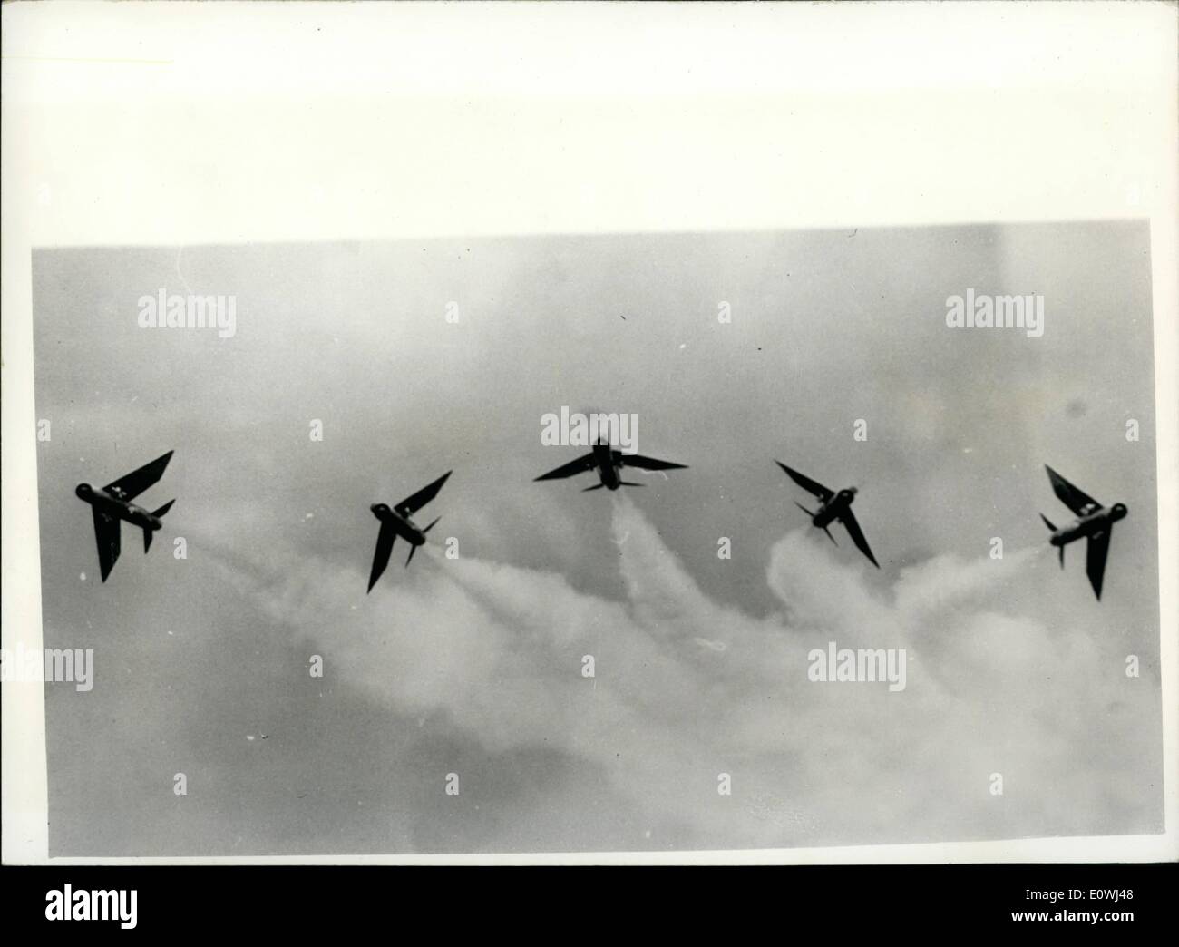 May 05, 1963 - New R.A.F. Aerobatic Team shows its paces. The Firebirds . No. 56 Squadron of Fighter Command who are the 1963 aerobatic team to perform at air displays etc. were practicing in their English Electric Lightnings over East Anglia yesterday. Photo Shows: The Lightnings carry out a Bomb-burst over their airfield at R.A.F. Wattisham yesterday. Stock Photo