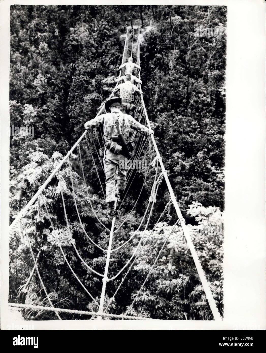 May 18, 1963 - Human to-tos learn the ropes.: In view of the trouble in South Vietnam, the United States have set-up a jungle training School in the hills of Okinawa so that they will be fully acquainted with the techniques of jungle warfare so that they can hold their own against the Communist guerillas in Leoa. The United States have some 12,000 men in South Vietnam and have suffered ''some casualties'' in addition the Vietnamese admit to having 4,000 killed and 6,000 wounded in the past year but it is claimed that 30,000 Communists have been killed Stock Photo
