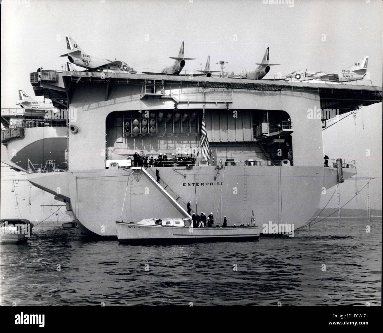 May 22, 1963 - The World's largest aircraft carrier: Currently exercising in the Mediterranean is the mighty American atom-powered aircraft carrier Enterprise. The Enterprise which is known as the ''Big-E'' is said to be large enough to carry both the Queen Elizabeth and the Queen Mary liners side by side on her flight deck. She carries 100 jet fighters and bombers, has a crew of nearly 5,000 has 20 decks and has cost ?150,000,000 to build. Photo shows view of the after end of the huge carrier said to be the largest vessel a float. Stock Photo