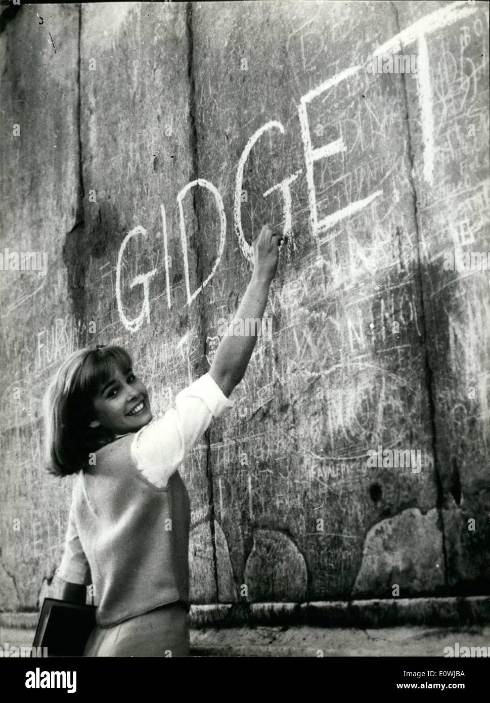 Mar. 03, 1963 - Cindy Caros the american young ''star'' who in filming in ''Gidget goes to Rome'' the teenager in touristic visit to the Capital, shooted in the Fountain of Trovi, one scene-of ''delee vita''; as Anita Ekberg also Cindy Carol jumps in it, but this time she is arrested ''for steeling-coins in the Fountain'' and brought to the American Embassy. Photo shows Cindy Carol writing her ''screen'' name on an ancient roman well, near Colosseo. Stock Photo