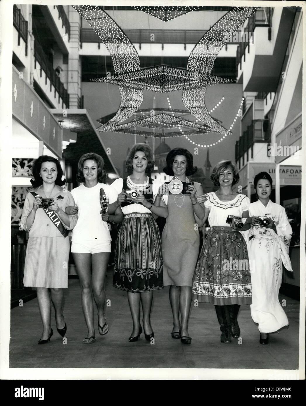 Mar. 04, 1963 - 4-3-63 International Lovelies at The Ideal Homes Exhibition. A Press view was held at Olympia this morning for the Ideal Homes Exhibition which opens there tomorrow. Keystone Photo Shows: Lovely young ladies from many countries in their National Dress and complete with cameras as they walk around the Exhibition today. They are L-R: Rhonda Finlayson (Australia); Janet Dale (Australia); Lilian Blagojevic (Russia); Pat Stewart (U.S.A.); Marianne Brauns (Germany); and Yule Thein of Japan. Stock Photo