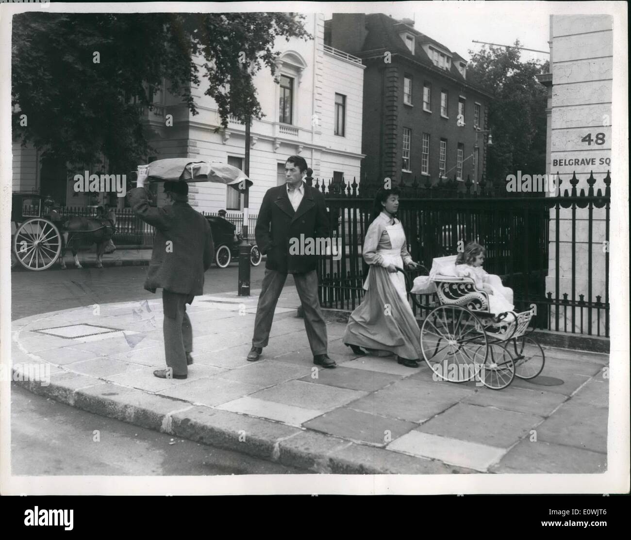 Jun. 06, 1963 - Past Echoes Sunday morning and London's Belgrave Square wakes to the sound of hansom cabs and a pie man. And - yes, your'e right, it's Gregory Peck, they were filming scenes from the new Rank film ''The Million Pound Note.'' Three year old Sheridan Williams sits very demurely in her smart carriage. Stock Photo