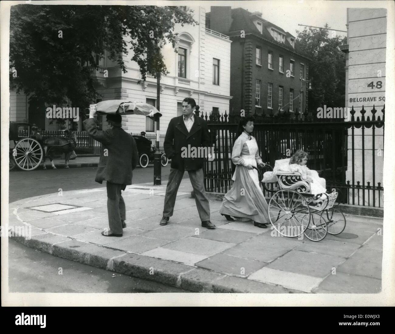Jun. 06, 1963 - Past Echoes: Sunday morning and London's Belgrave Square waloes to the sound of hansom cabs and a pie man. And - yes, you're right, it's Gregory Peok. They were filming scenes from the new Rank film ''The Million Pound Note''. Three year old Sheridan Williams sits very demurely n her smart carriage. Stock Photo
