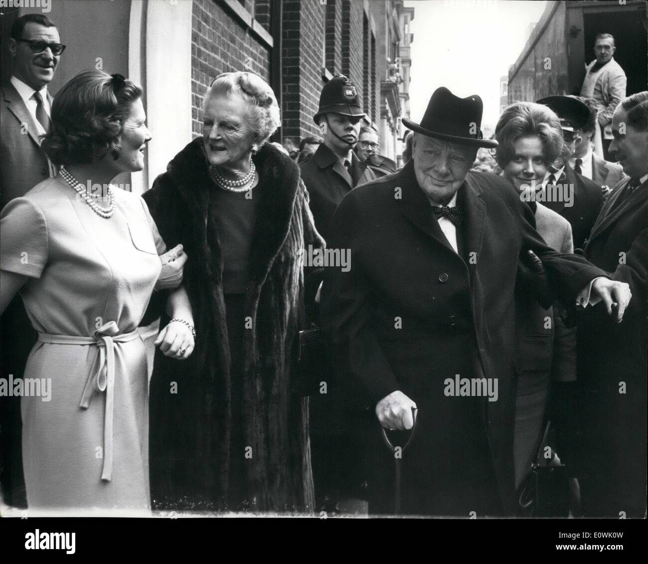Apr. 04, 1963 - Lady Churchill's 78th birthday - family Luncheon.: Lady Churchill was 78 yesterday, and in celebration of the occasion a small family luncheon was held at the Westminster flat of her daughter Mary, Mrs. Christopher Soames. Photo shows a family group in the street outside the flat, (left to right) daughter Mary Soames, Lady Churchill, sir Winston Churchill, and daughter Edwina, (Mrs. Piers Dixon) Stock Photo