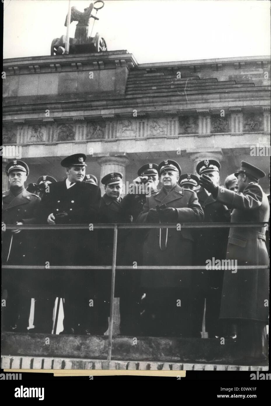 Apr. 04, 1963 - Polish defence-minister looks on the wall Nearly to the same time, when American chief-delegate of the United Nations, Adlai E. Stevenson, makes his sight seeing tour along the wall. In East-Berlin Polish defense-minister General Spychaiski comes to see the wall on ''the other side''. OPS:- The Polish military-delegation on Brandenburg Gate. Spychaiski third from right with a binocular. On right (with lifting arm) the East-Berliner town-commander Poppe. Stock Photo