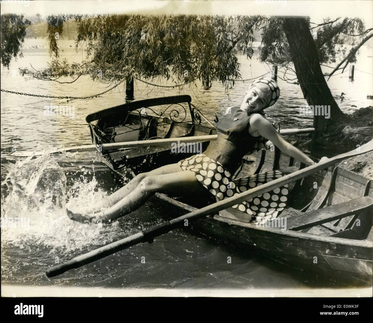 Jun. 06, 1963 - It's a cool June.: June Ritchie takes things nice and easy while celebrating her 22nd birthday yesterday by relaxing on the Serpentine while London sizzled in the eighties. Stock Photo