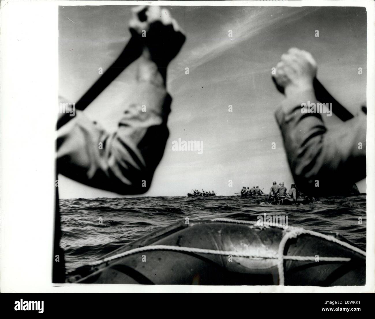 Apr. 26, 1963 - New technique for landing Reconaissance Parties.: The U.S. Submarine Segundo has been carrying out trials with marines off Okinawa. The idea being that the marines take their places in rubber rafts on the forward deck of the submarine which then submerges leaving the men to paddle quietly ashore. After completing the mission the troops return to the submarine which watches for them through the periscope. In the event of enemy fire preventing the submarine from surfacing, the troops could tie a rope to the periscope and be towed out to sea Stock Photo