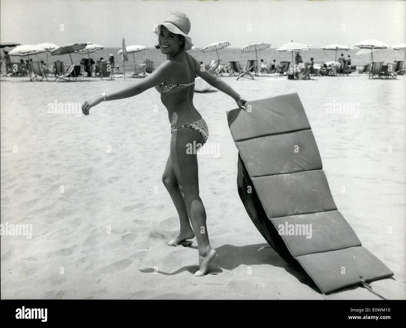 Jul. 07, 1963 - Fregene the most fashionable seaside near Rome is the favorite beach of romana including actors and actresses who reach it every morning and opened there their free time. Photo shows. Italian starlet Maria Grazia Spina gayly relaxing on the beach. Stock Photo