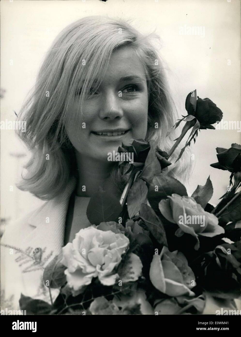 Jul. 17, 1963 - The American actress Yvette Mimieux arrived at Orly for a short vacation in Paris. She is wrapping up filming for Georges Pal's ''The Wonderful World of the Brothers Grimm,'' in which she is the female star. Here she is at her arrival at Orly Airport with a bouquet of roses. Stock Photo