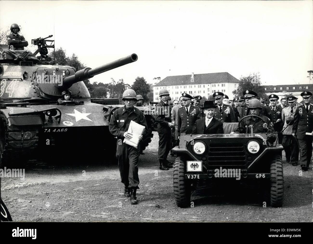 May 05, 1963 - German President sees display of US arms German Federal President Dr. Heinrich Luebke (with black Homburg hat) was guest of the US-Army's V. Corps During a display of new equipment and arms at Campo Pond near Hanau, Germany. President Luebke was accompanied by Usareur Commander in Chief, General Freeman, and the Commander of V. Corps, General Michaelis. On the M-60-tank, the 105-mm-recoilless rifle mounted on a jeep and several combat missiles. Stock Photo