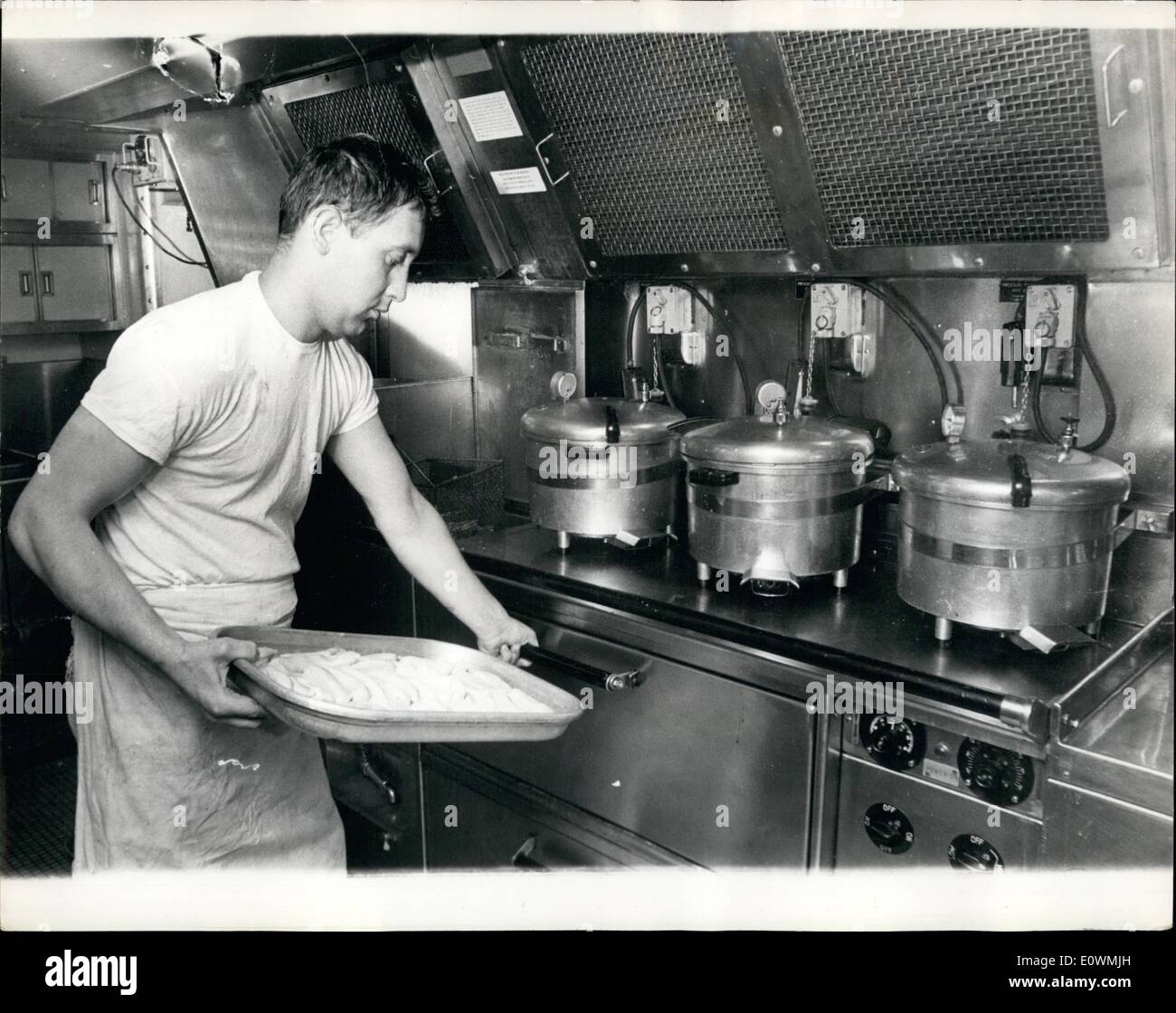 Sep. 09, 1963 - Deadnought at Sea; Britain's first nuclear powered submarine , ''Dreadnaught'' was exercising in the English Channel yesterday. Photo Shows ''Hands to Dinner'' Sausages for the crew are seen being prepared in the Galley of the Dreadnaught. Stock Photo