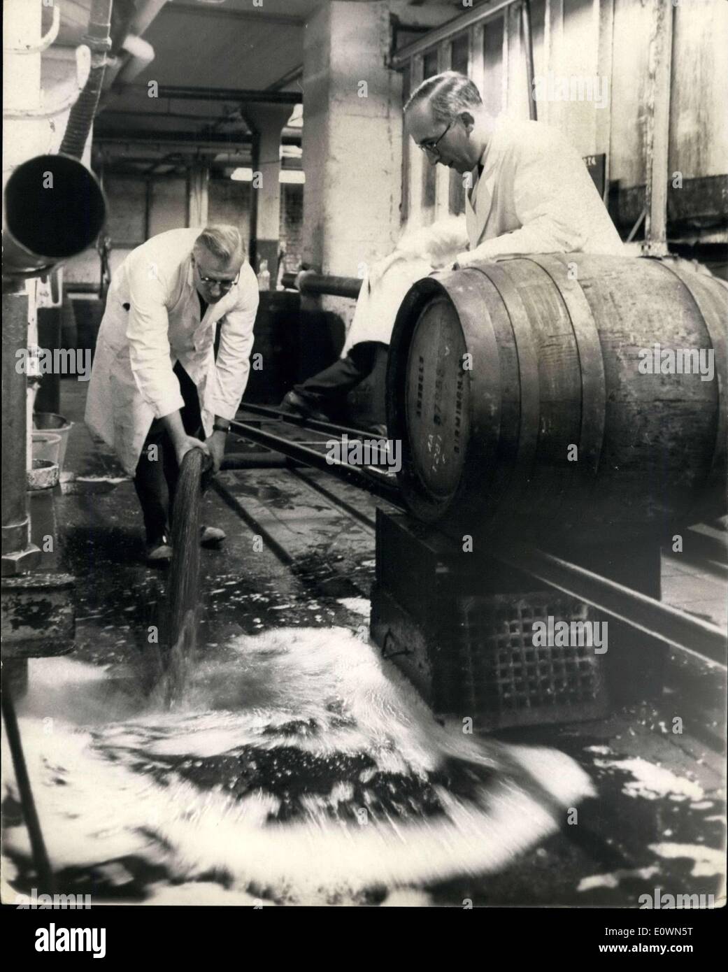 Oct. 05, 1963 - Five million pints of beer wasted because of a strike ? Two hundred and fifty thousand pints of beer went down the drain yesterday at Ansell?s Brewery at Birmingham and it is to be followed by another five million pints within the next few days. The reason? Said the spokesman for the firm: The beer has become spoiled because 1,300 production and transport workers at the brewery went on strike claiming that a cellarman shop steward had been victimized. Photo Shows: Some of the beer going down the drain at the brewery yesterday. Keystone Stock Photo