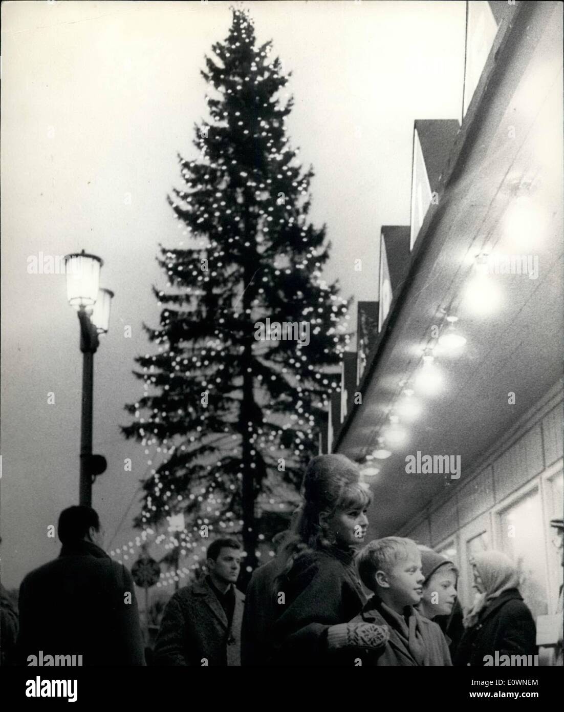 Dec. 12, 1963 - Christmas in Eastberilin : First time sine 1960 Berliner from both parts of the town can have Christmas together in this year. more than hundred thousand the west Berliner can see their relations in Eastberlin in the Christmas days. photo shows A young Westberliner girl with her cousins from east Berlin on the Easterberliner Christmas- market in the frankfurter Allee. Stock Photo