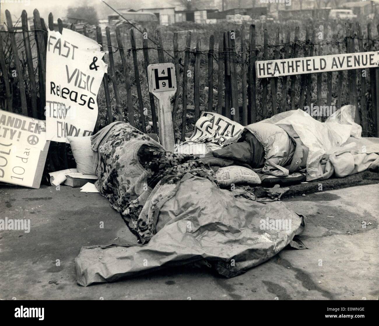 Dec. 23, 1963 - ''Fast To Death'' Outside Wandsworth Prison: Two members of the committee of X 100, George Cabutti and Zion Silverstein, are on the fifth day of a ''fast to death'' outside Wandsworth Prison where Terence Chandler has started to serve his sentence of nine months for his part as Field Secretary of the committee during their demonstrations during the Greek Royal visit. The two re protesting against the severity of the sentence. The committee have sent telegrams to the Queen and the Home Secretary advising them of the fast Stock Photo