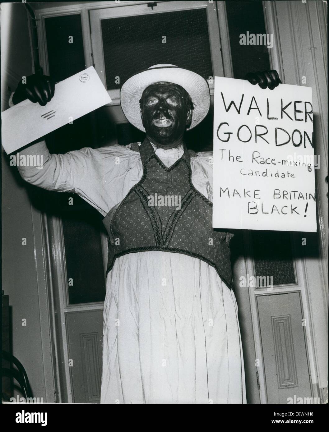 Jan. 01, 1964 - He calls himself ''Mr. Walker Gordon'' Nazi - Colin Jordan and his wife: A man with his face blacked and calling himself Mr. Walker Gordon called at the Leyton Town Hall this afternoon to hand in nomination papers as the Candidate for the National Socialist Movement. Self styled Nazi - Colin Jordan made a speech from the Town Hall steps after the incident. Photo shows Colin Jordan and his wife give the Nazi salute after the incident this afternoon. Stock Photo