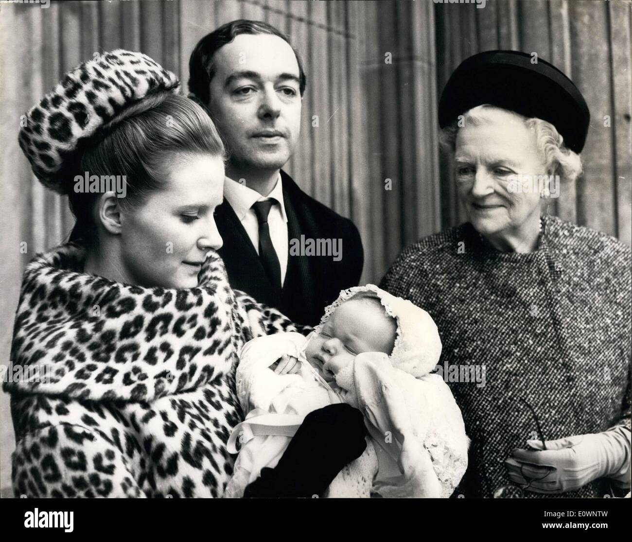 Jan. 01, 1964 - Christening of Sir Wilson's great grandson at St Paul's: Hugo, son of Mr. and Mrs. Piers Dixon, and great grandson of Sir Winston Churchill was christened this morning at St. Paul's , his mother is Sir Winston's granddaughter Edwina. Photo shows after the christening, Hugo with his parents and his great grandmother, Lady Churchill. Stock Photo