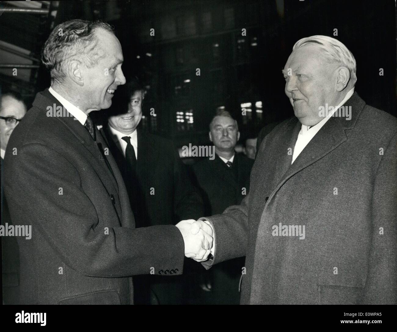 Jan. 01, 1964 - Sir Alec greets Dr. Erhard. The West German Chancellor Dr. Ludwig Erhard arrived in London today for a two-day visit. After his arrival at Gatwick Airport, he was greeted at Victoria Station by Prime Minister Sir Alec Douglas-Home. Photo Shows: Sir Alec Douglas-Home greets Dr. Erhard at Victoria this morning. Keystone Stock Photo