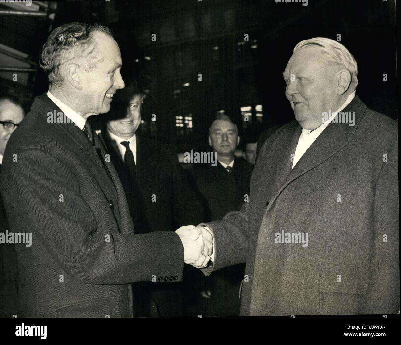 Jan. 01, 1964 - Sir Alec Greets De Erhard: The West German Chancellor Dr. Ludwig Erhard arrived in London today for a two-day visit. After his arrival at Gatwick Airport, he was greeted at Victoria St Prime Minister Sir Alec Douglas Home. Photo Shows Sir Alec Douglas-Home greets Dr. Erhard at Victoria  meeting. Stock Photo