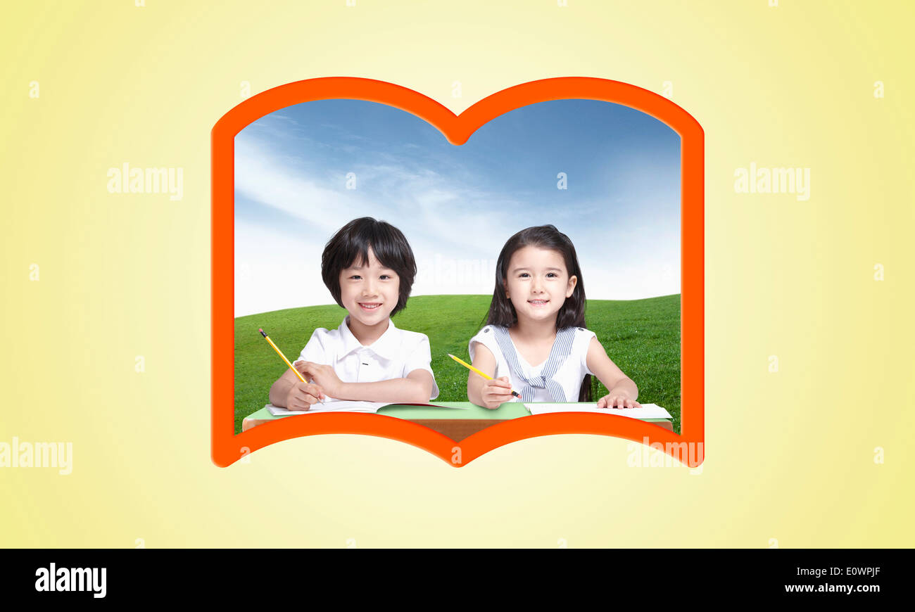 a boy and a girl in a book shape frame Stock Photo