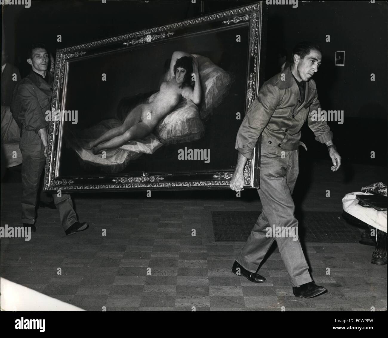 Nov. 11, 1963 - Goya paintings arrive in London; Paintings by Goya worth 3,000,000 are being brought to London from Spain by secret routes to go on show at the Royal Academy next month. Photo Shows Two Spanish officials carry the priceless Maja Desmund through the empty halls of the Royal Academy. Stock Photo