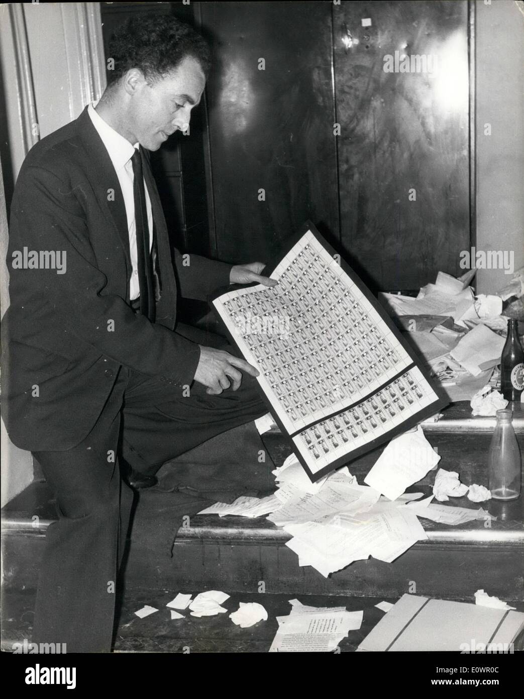 Feb. 02, 1964 - 100,00 Stamps Raid in the Strand: Rare stamps worth up to 100,000 were stolen by a gang who broke into the office of a leading Strand stamp dealer in London last night. The raiders cut open two safes containing hundreds of rare and historic stamp. Some of them unique, including a sheet of 120 New Zealand 1/9d railway stamps issued last year with their value and red colouring omitted, valued at about 10,200. Photo shows Mr Stock Photo