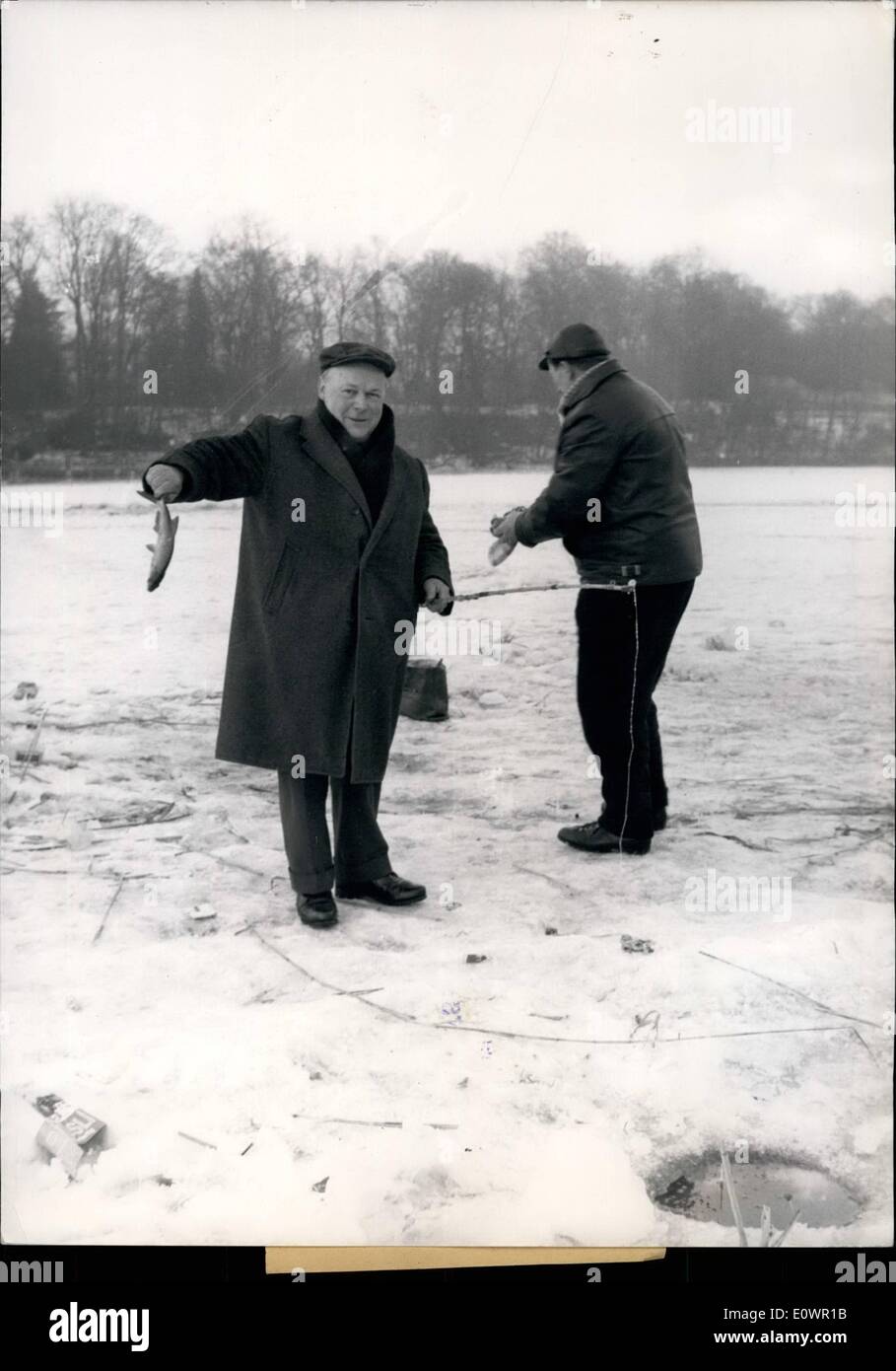 Feb. 02, 1964 - These anglers are thickly hooded and have no problem braving the cold snap gripping Berlin as they stand on the Stock Photo