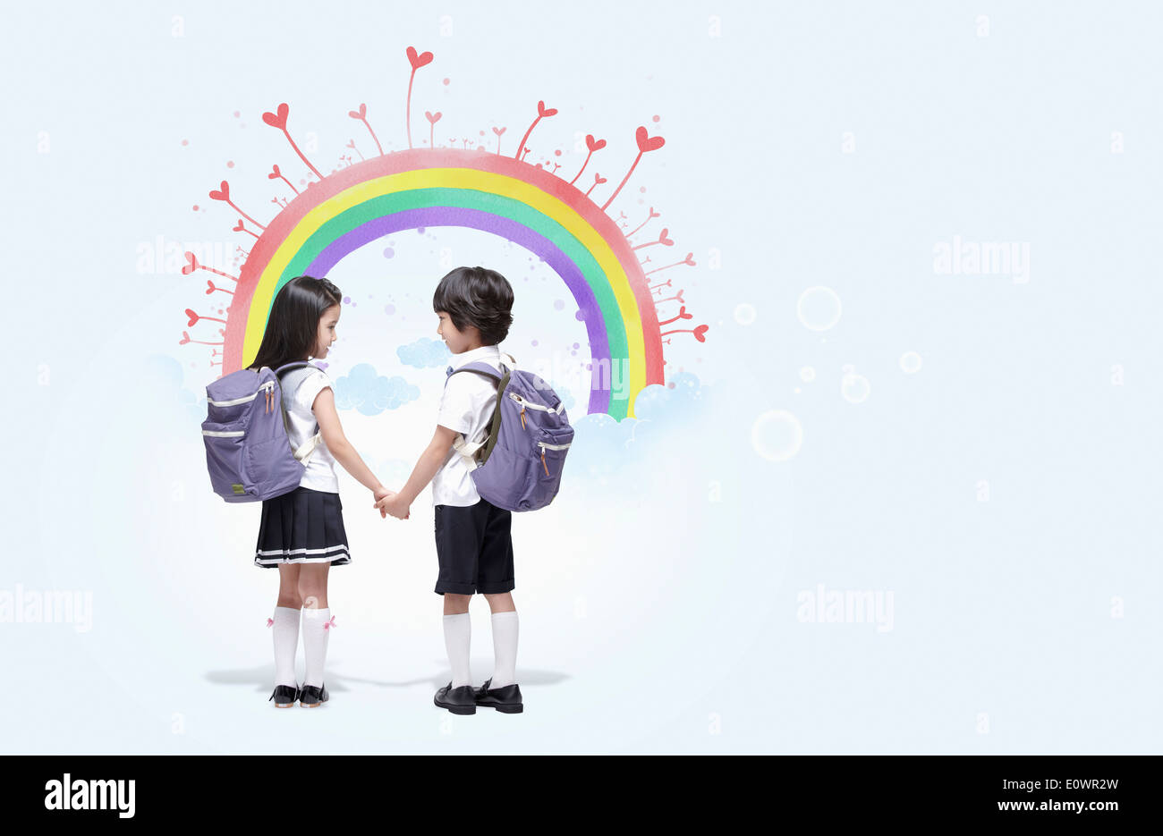 a boy and a girl holding hands Stock Photo - Alamy