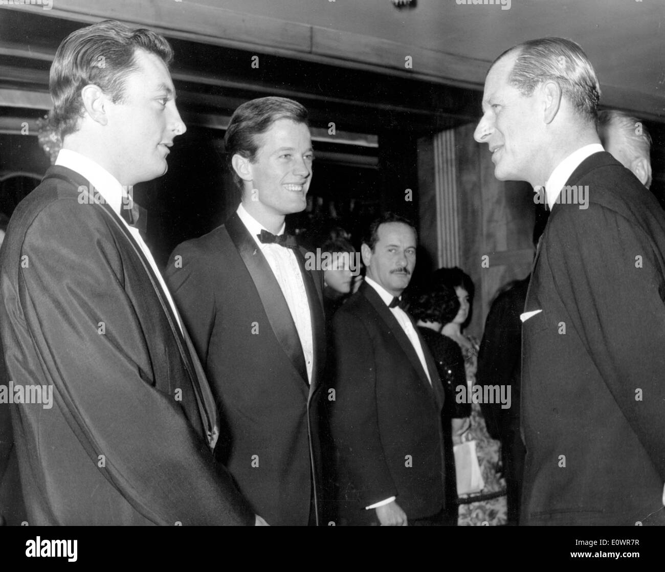 Prince Philip talks to the stars of 'The Victors' at premiere Stock Photo