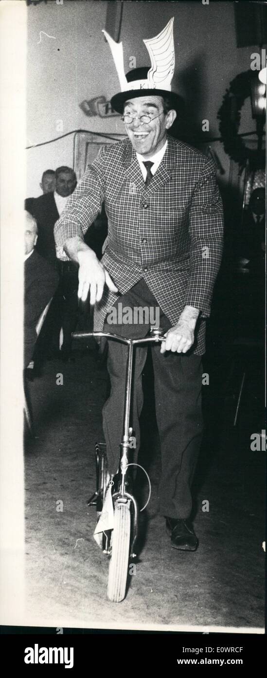 Feb. 02, 1964 - This time is named ''dure''. Photo shows the famous Bavarian comedian Georg Bladl on his bicycle, driving through the beer-hall on the Munich Nockher-Berg and telling everybody, who wants to know it, that the wonderful time of the Starkbier is coming now. Stock Photo