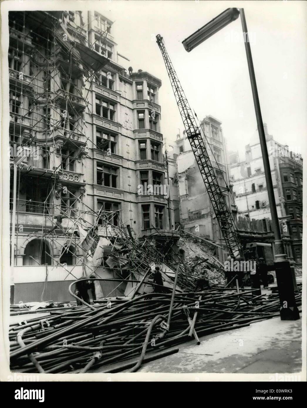 Dec. 12, 1963 - London's Victoria Street Closed to Traffic. Building Collapses During Demolition Work. Rescue workers dug frantically last night when a six story building, which was being demolished, collapsed into the roadway, in London's Victoria Street, West minster. It was thought that two people had been trapped beneath the fallen ruble. It was found later that they must have managed to avoid the rubble. the street has been closed to traffic while clearing up operations progress Stock Photo