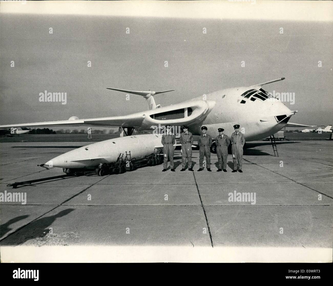 Feb. 02, 1964 - Britain's ''V'' bombers on show.: A press visit was held today to the Bomber Command station of the Royal Air Force at Wittering. Photo shows in readiness, the crew of a Victor bomber are seen near their aircraft, with a ''Blue Steel'' supersonic guided missile which carries a nuclear warhead in the megation range. Stock Photo
