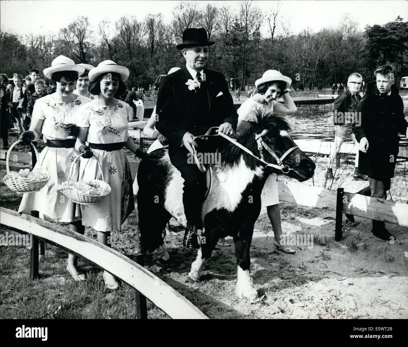 Apr. 04, 1964 - American Ambassador on pony: The American Ambassador in the Netherlands, Mr. John S. Rice opened the Keukenhof at Bennebroek near Haarlem. The Keukenhof is the famous bulbflower - garden, visited by thousands of foreigners every year. After the opening the Ambassador rode a pony escorted by the Dutch flower-hostesses. Photo shows American Ambassador Mr. John Rice on the pony, escorted by the flower hostesses. Stock Photo