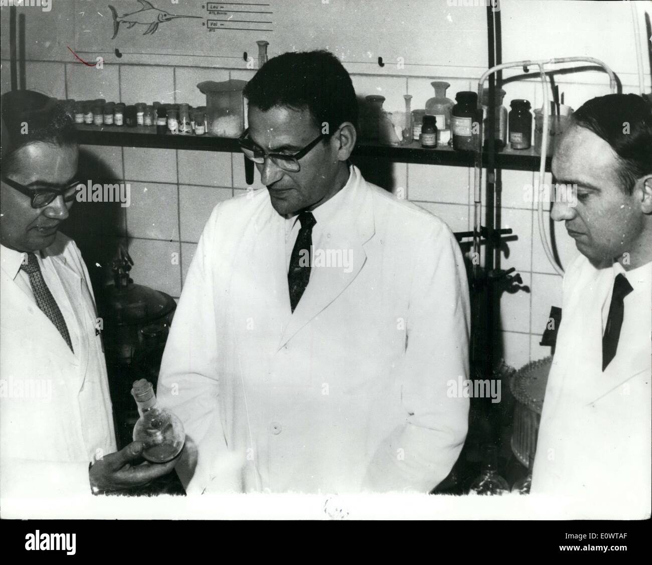 Feb. 14, 1964 - Achen Scholars produce synthetic Insulin: Until now, Insulin, which is required by diabetes sufferers, could only be obtained from the pancreas of animals, but now, after eight years of research scientists of the Technical High School at AACHEN in Germany have achieved a breakthrough by developing a synthetic type of Insulin, thus putting them ahead of scientists of other natiions includig America who have been working on similar projects. Photo shows The leader of the team, Dr.Helmut Zahn (Center) with two of his collaborators, Dr Stock Photo