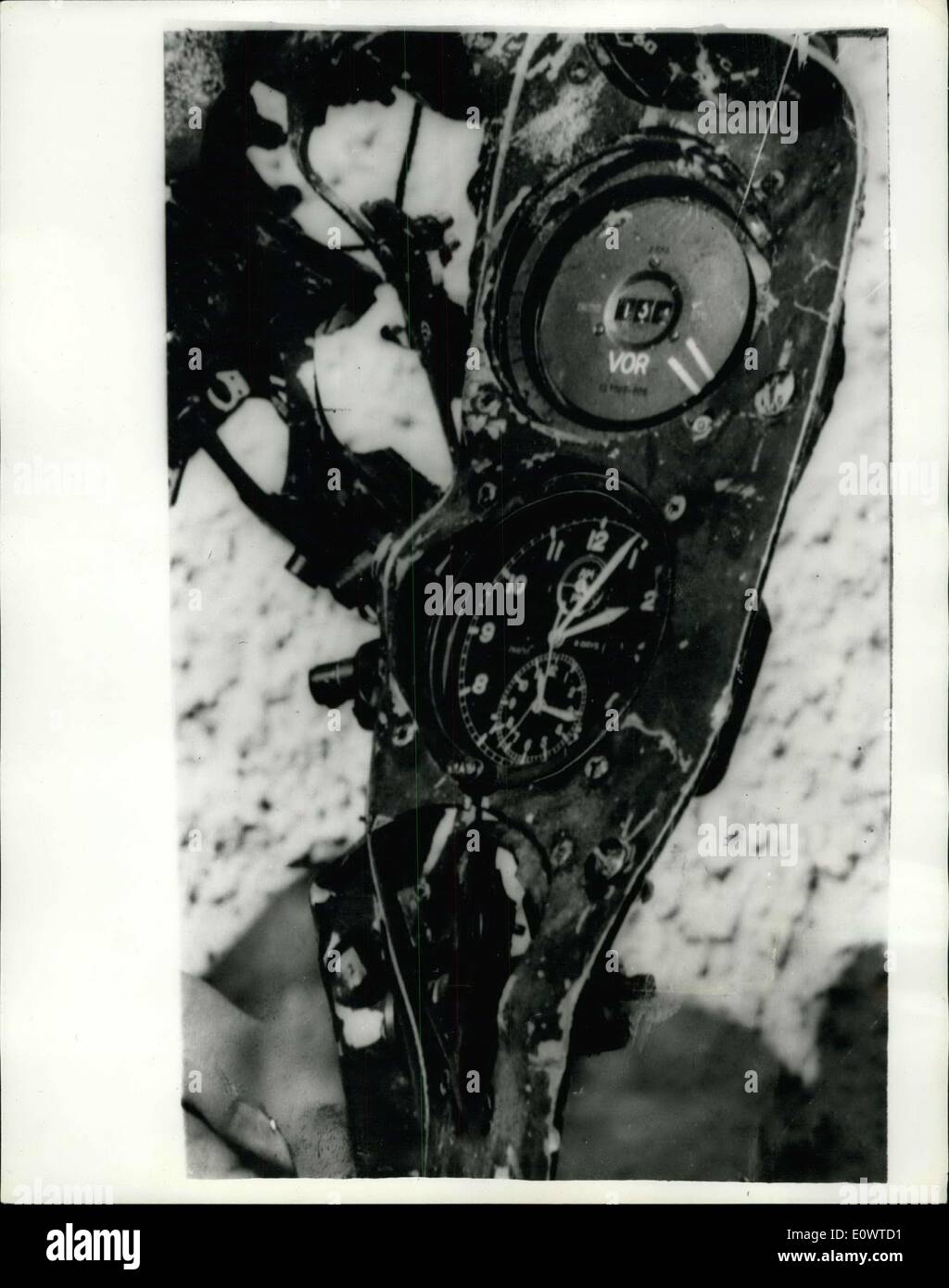 Mar. 03, 1964 - Time Riddle Of The Crashed Airlines: A clock on a battered instrument instrument panel may give a clue to why the Bristol Britannia airliner crashed into the Glungezer Mountain near Innsbruck, killing all 83 people on board. The hands of the clock, which was found amongst the wreckage yesterday, stand at four minutes past two, which was nine minutes before Innsbruck received the last message from the plane, reporting it's height to be 10,000 ft., which suggests to experts that the plane suffered from trouble in the electrical systems a little time before the crash occured Stock Photo