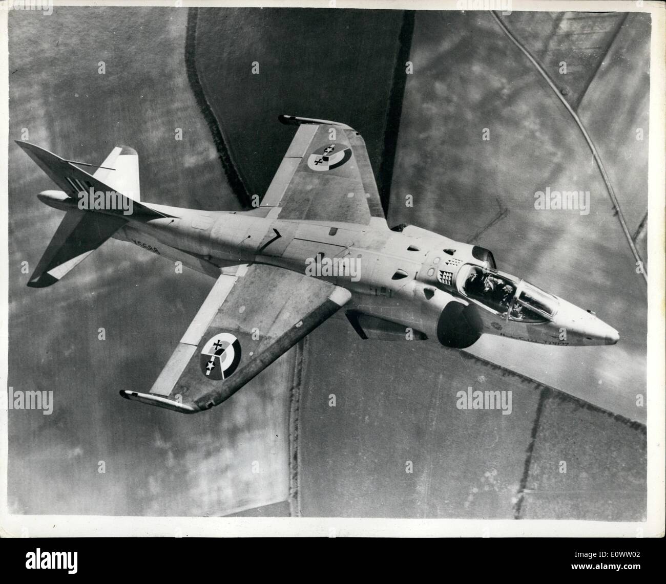 Apr. 04, 1964 - Three in one sign for Jumping jets. The world's first ''Jump Jet'' warplane squadron , equipped with Hawker Siddeley's P 1127 vertical aircraft, is due to begine operating early next year from the R.A.F. airfield at West Raynham., Norfolk, will be manned by crews and ground staff from the R.A.F and the American and west German air forces, and the nine aircraft will carry a new roundel symbol which incorporates the markings of all three of these air forces.... the red, white and blue of the R.A.F., the Luftwaffe's iron cross, and the U.S.A.F star. Photo shows one of the P Stock Photo